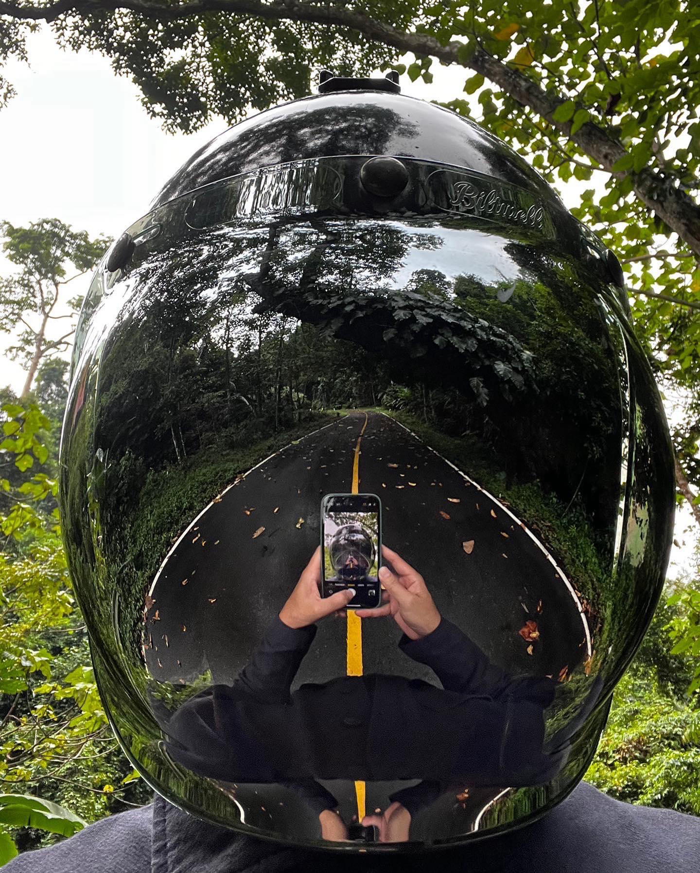 image  1 apple - I like playing with the reflection of my helmet in the front camera to see the forest aroun